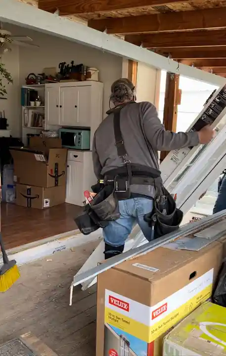 Crew installing a new door at the Gleed doors and windows job