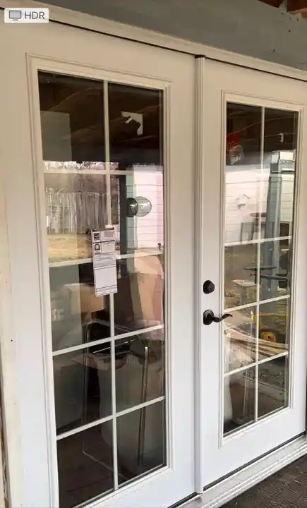 New French doors installed on the Gleed house