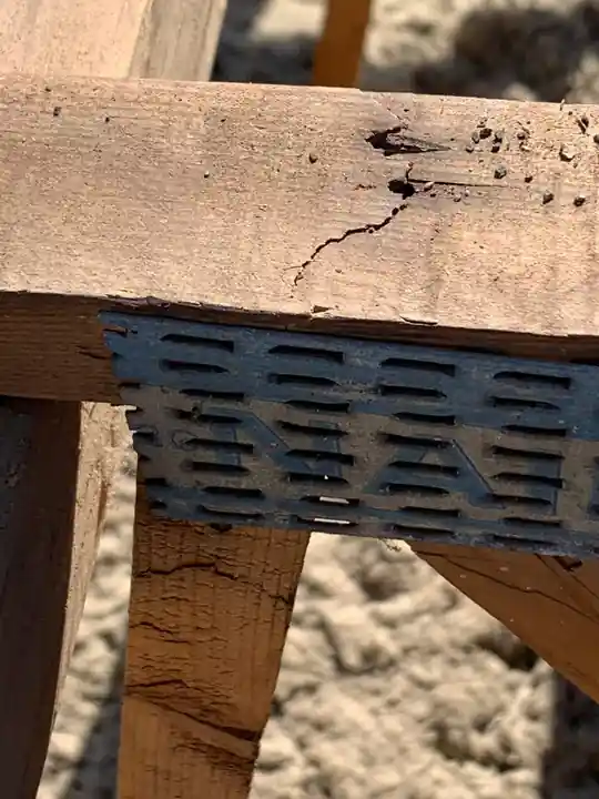 Crew reinforcing cracked trusses on a manufactured home roof in Yakima after tear-off
