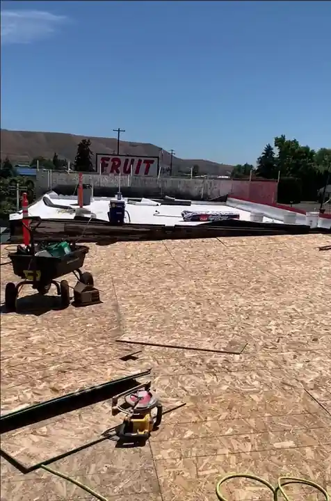 New 7/16 OSB panels going down on the Naches Fruit Stand roof