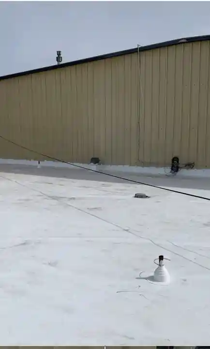 60 mil TPO membrane run up a parapet wall on the Syntec US roof in Yakima